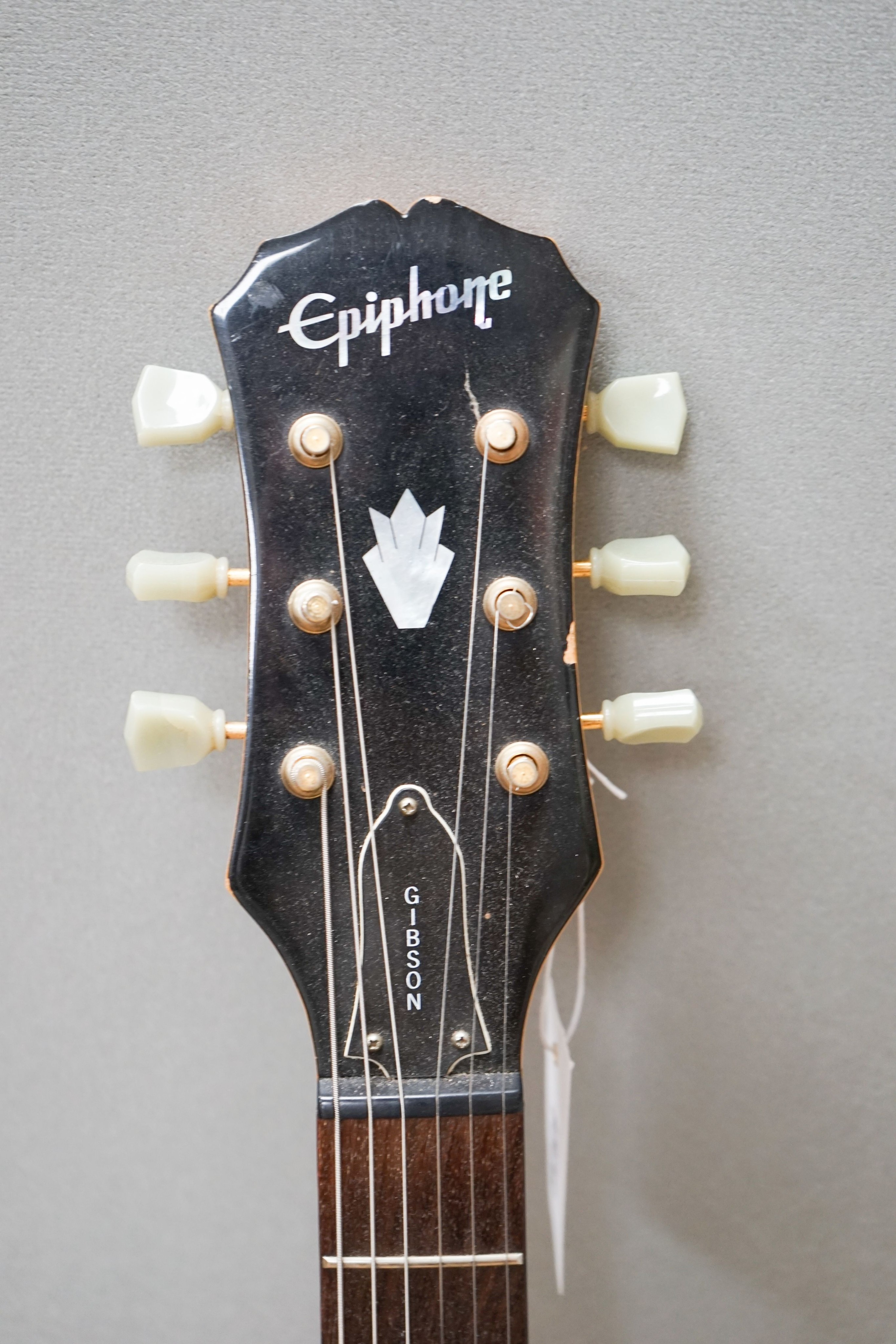 An Epiphone SG guitar, serial no. UOO111768